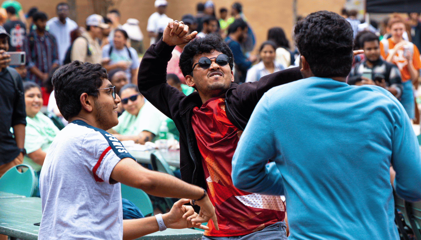 students in library mall dancing