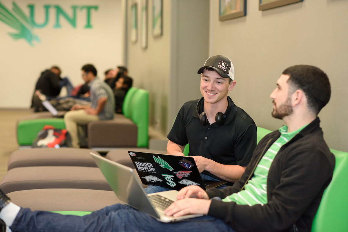 two students studying in a lounge