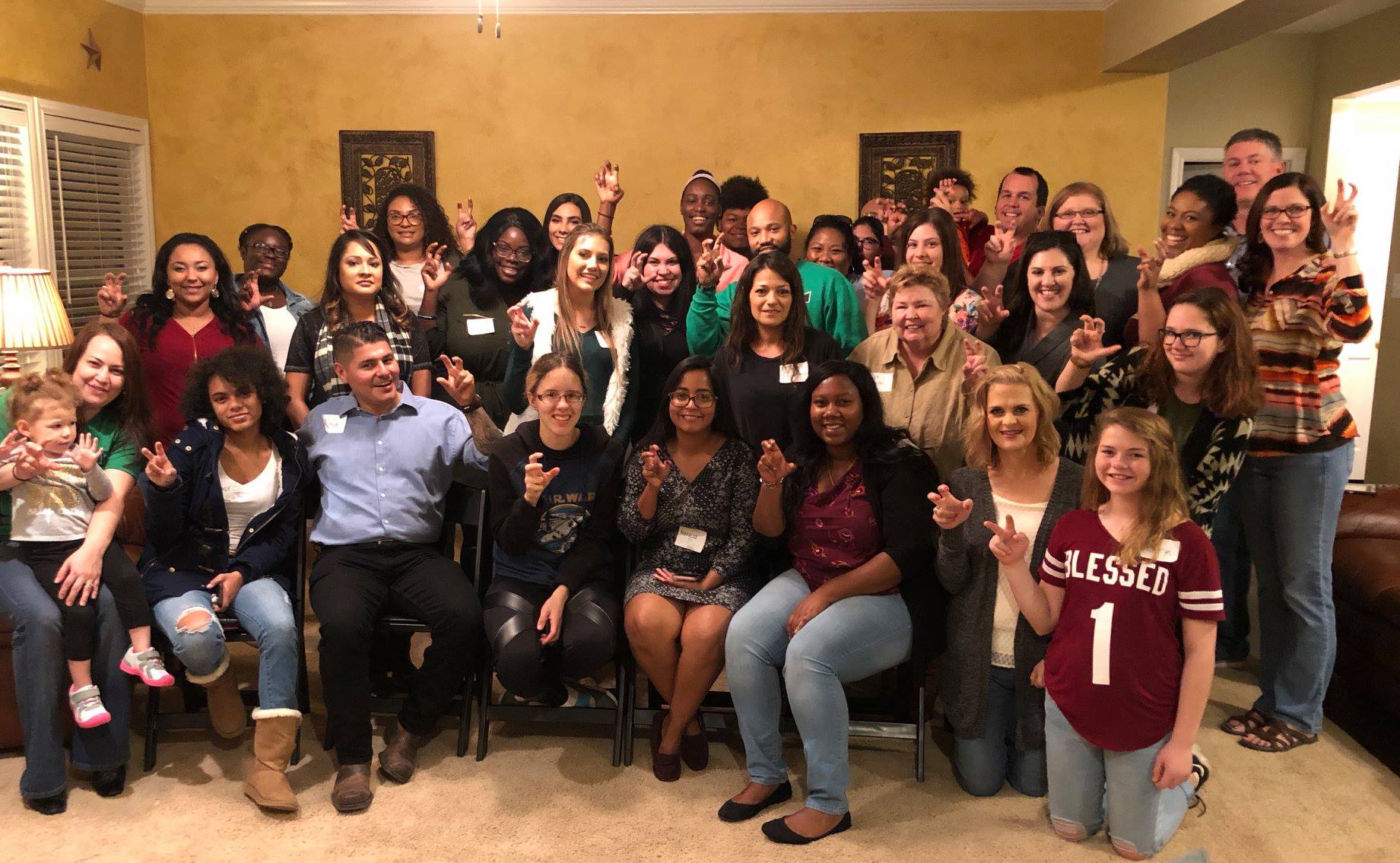 Students and alumni at thanksgiving potluck