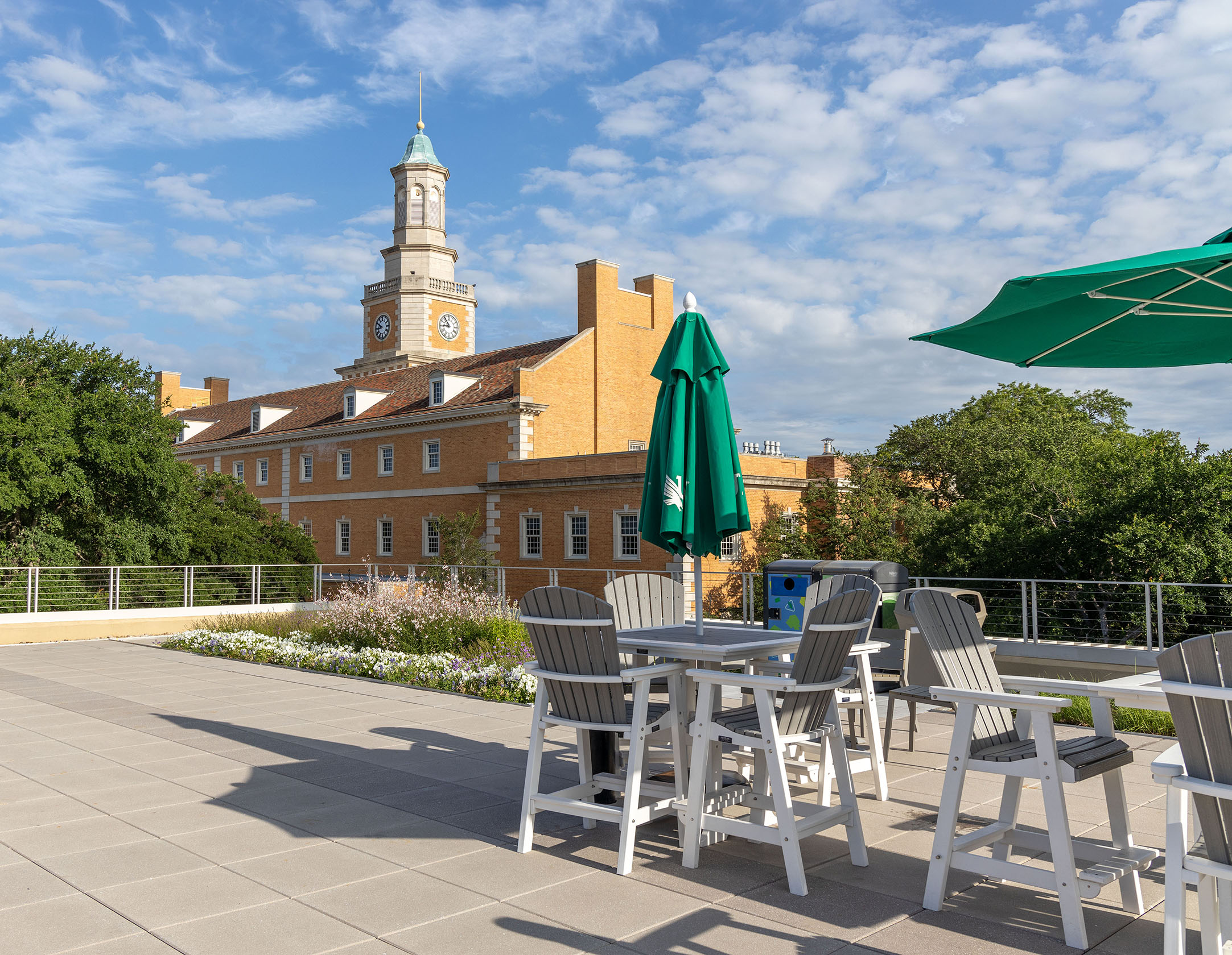 Photo of University Patio Rooftop with a blue sky and view of the Hurley Building